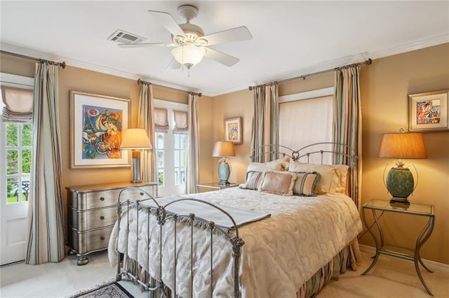 bedroom with ornamental molding, visible vents, and multiple windows