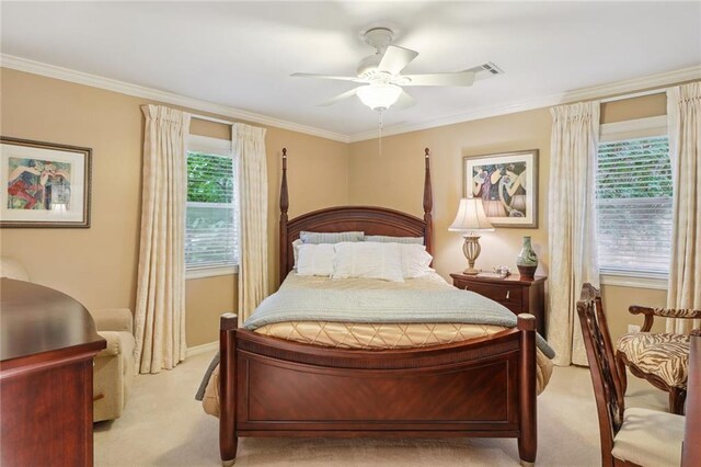 bedroom featuring multiple windows, light carpet, ornamental molding, and ceiling fan