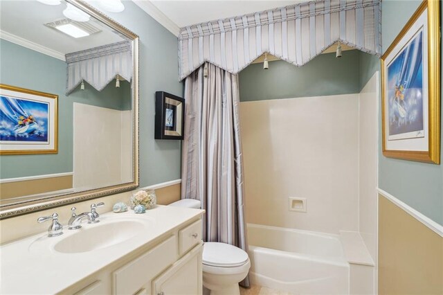 full bathroom with ornamental molding, shower / bath combo with shower curtain, vanity, and toilet