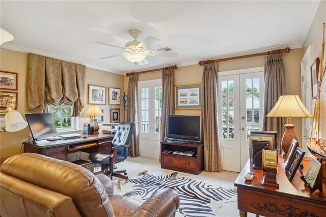 carpeted office space featuring ceiling fan, crown molding, and french doors