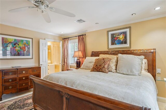 bedroom with ceiling fan, crown molding, and ensuite bath