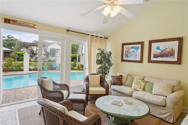 interior space with vaulted ceiling, a swimming pool, and a ceiling fan