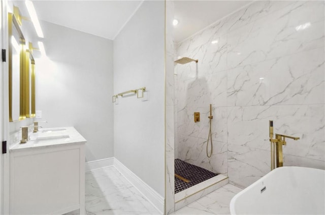 bathroom featuring a marble finish shower, baseboards, marble finish floor, a freestanding bath, and vanity