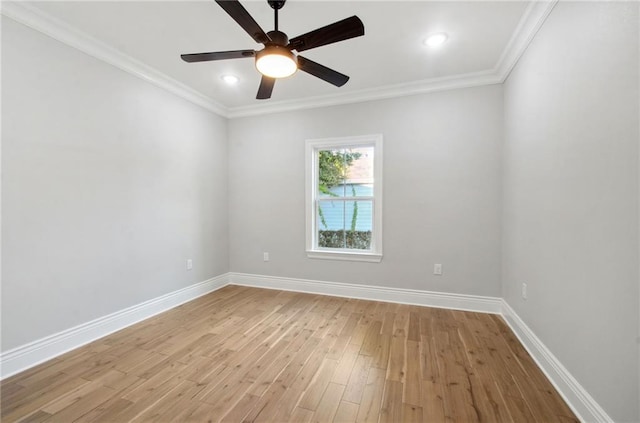 empty room featuring baseboards, ceiling fan, ornamental molding, and light wood-style floors