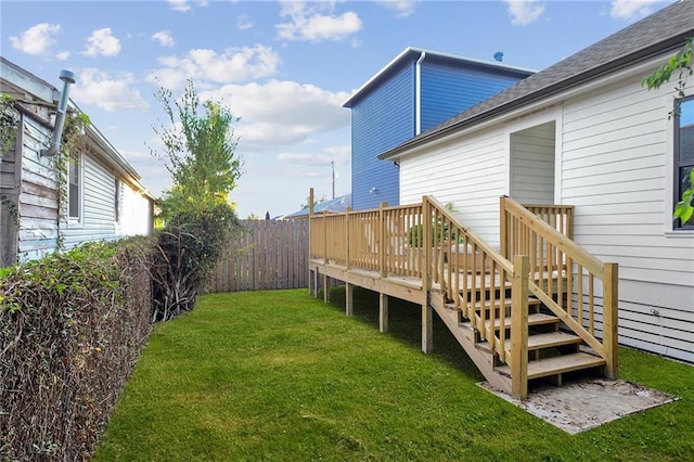 view of yard with a fenced backyard, stairway, and a wooden deck