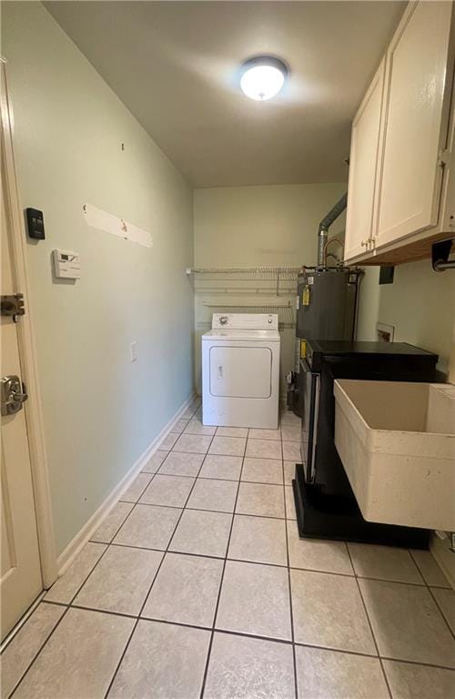 laundry area with light tile patterned floors, sink, water heater, cabinets, and washer / clothes dryer