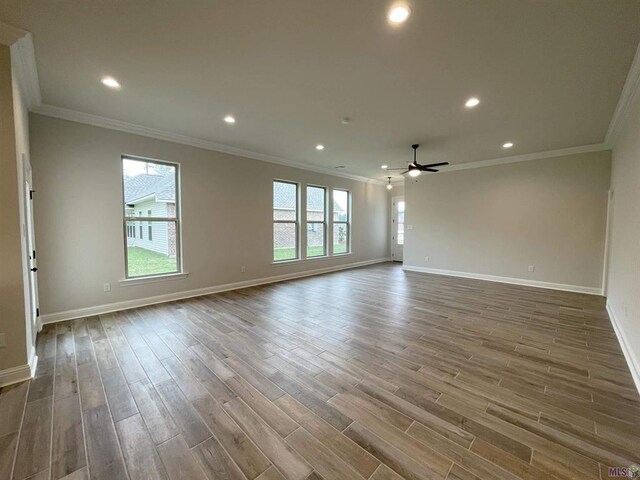 unfurnished room featuring crown molding, hardwood / wood-style floors, and ceiling fan