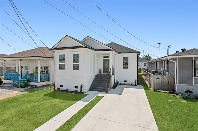 bungalow-style home featuring a front yard