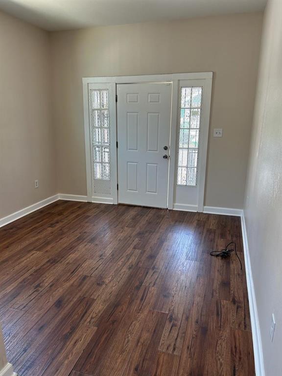 entrance foyer with hardwood / wood-style floors