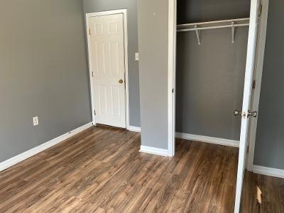 unfurnished bedroom featuring hardwood / wood-style floors and a closet