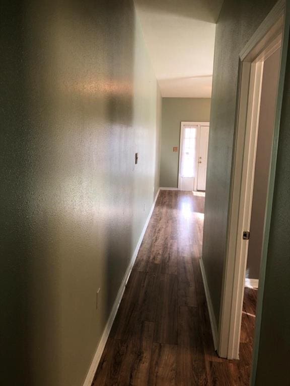 201214 Congress St, New Orleans, LA 70117 - hall featuring dark wood-style floors and baseboards