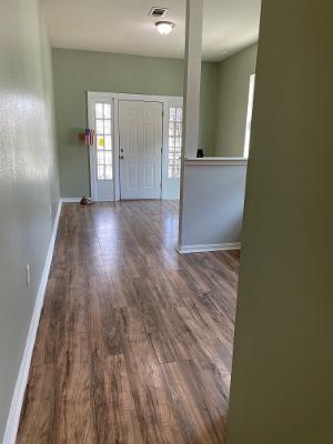 201214 Congress St, New Orleans, LA 70117 - foyer featuring baseboards and wood finished floors