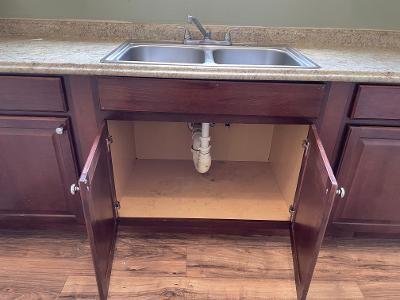 exterior details featuring sink and light wood-type flooring