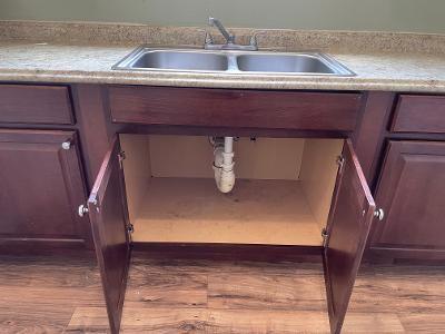 201214 Congress St, New Orleans, LA 70117 - room details with light countertops, a sink, and wood finished floors