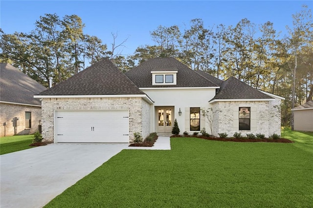 view of front of property featuring a garage and a front lawn