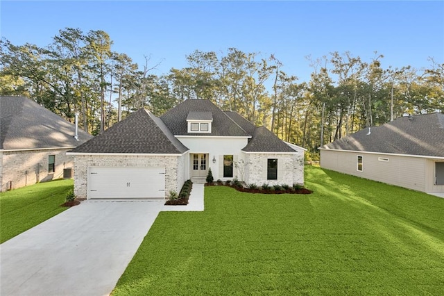 view of front of home with a garage and a front yard