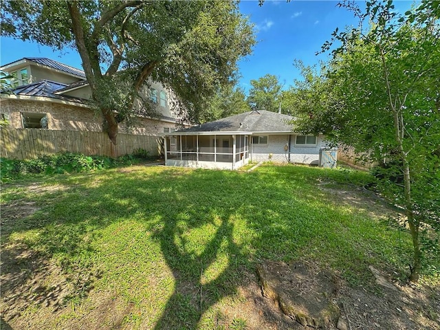 view of yard with a sunroom