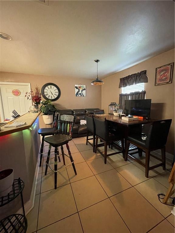 dining area with light tile patterned floors