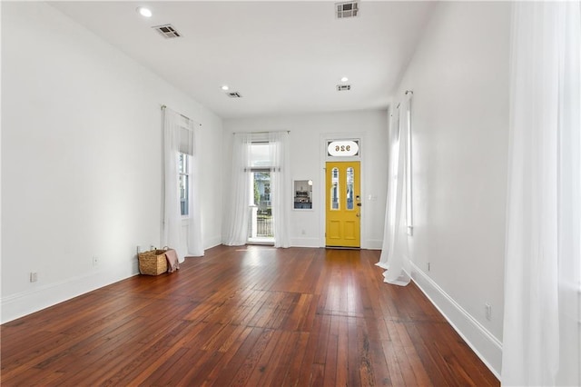 entrance foyer featuring dark hardwood / wood-style floors