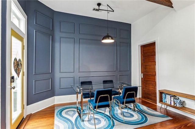 office space featuring hardwood / wood-style floors and beamed ceiling