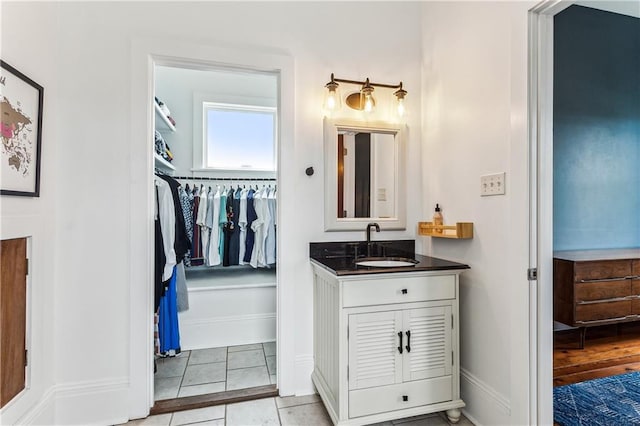 bathroom featuring tile patterned flooring and vanity