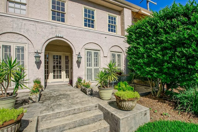 property entrance featuring french doors