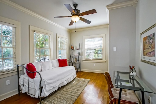 bedroom with ceiling fan, light wood-type flooring, and crown molding