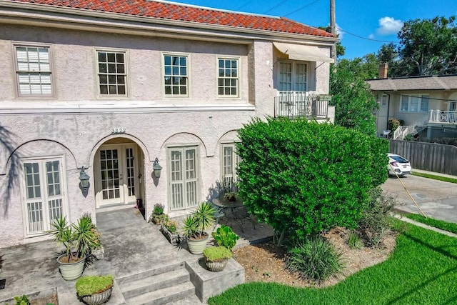 rear view of property featuring french doors