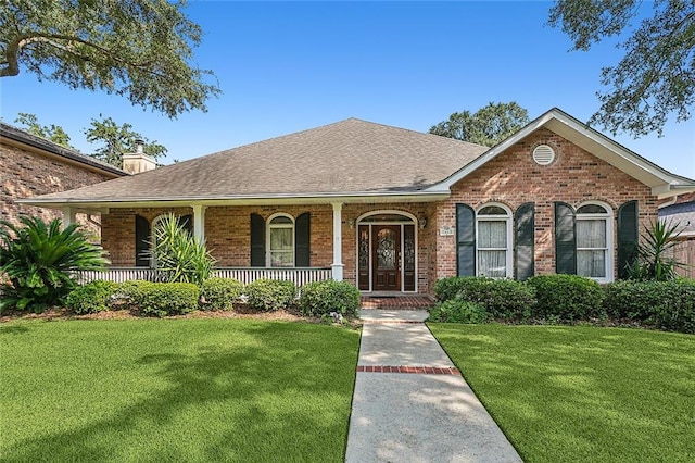 ranch-style home with a front yard and covered porch