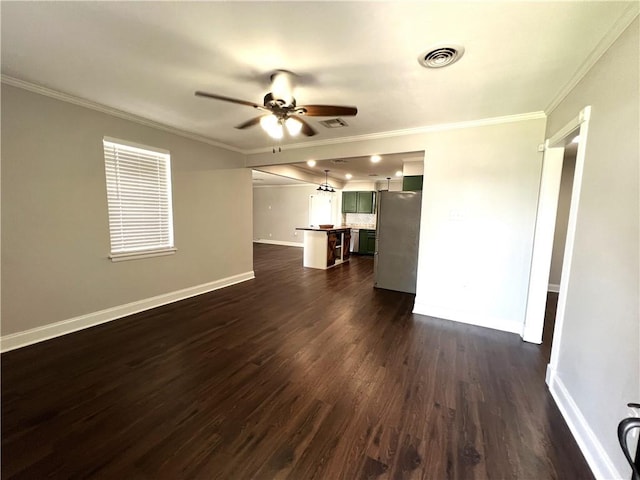 interior space with ceiling fan, dark wood-type flooring, and crown molding