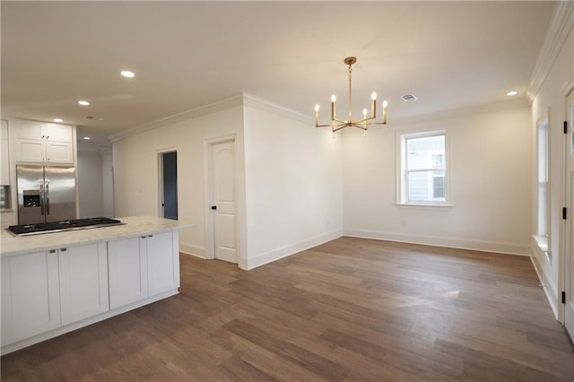 kitchen featuring crown molding, stainless steel appliances, dark hardwood / wood-style flooring, and white cabinets