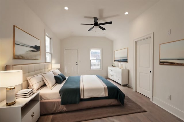 bedroom featuring hardwood / wood-style floors, ceiling fan, and lofted ceiling