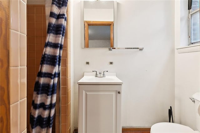 bathroom featuring vanity and toilet