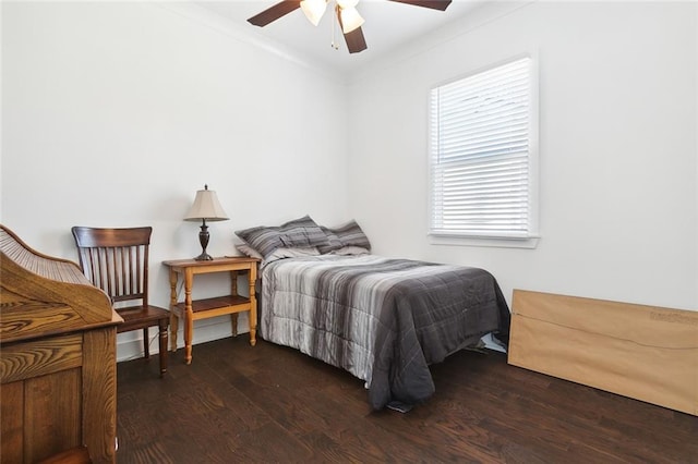 bedroom with multiple windows, hardwood / wood-style floors, and ceiling fan