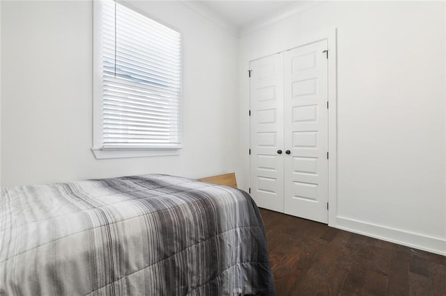 bedroom with hardwood / wood-style flooring and a closet