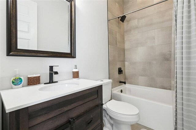 full bathroom featuring toilet, shower / tub combo, and vanity