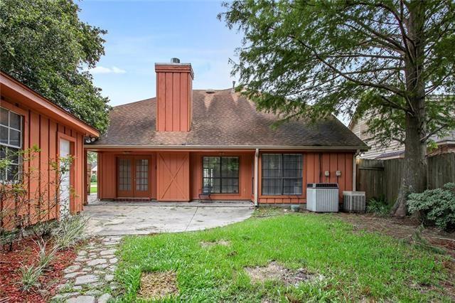 5 Kings Canyon Dr, New Orleans, LA 70131 - rear view of house featuring central air condition unit, a lawn, a patio, fence, and french doors