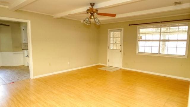 unfurnished room featuring visible vents, baseboards, ceiling fan, beamed ceiling, and light wood-style floors