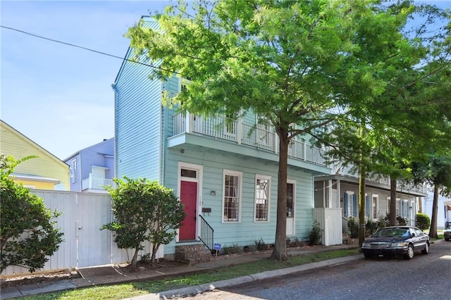 view of front of home with a balcony