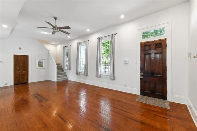 entryway with ceiling fan and wood-type flooring