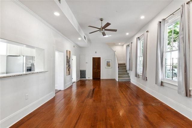 unfurnished living room with ceiling fan and hardwood / wood-style floors