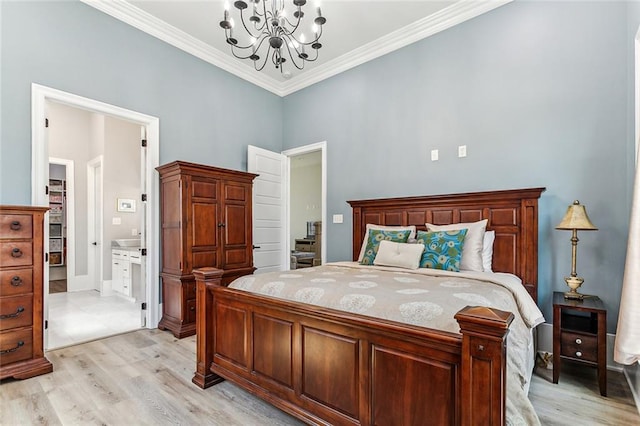 bedroom with crown molding, an inviting chandelier, and light hardwood / wood-style flooring