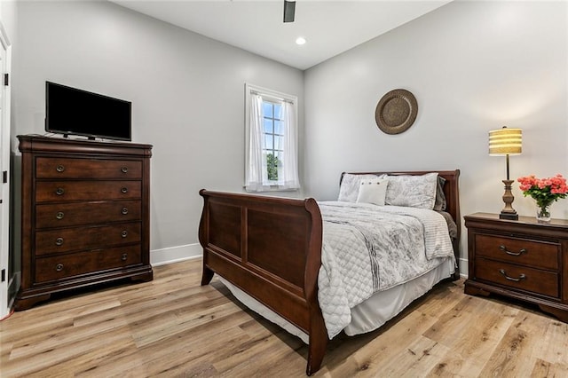 bedroom featuring light wood-type flooring and ceiling fan