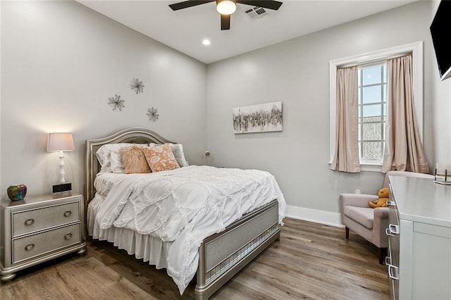 bedroom with ceiling fan and wood-type flooring