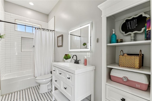 full bathroom with tile patterned floors, vanity, shower / bath combo, and toilet