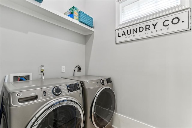 washroom featuring washer and dryer