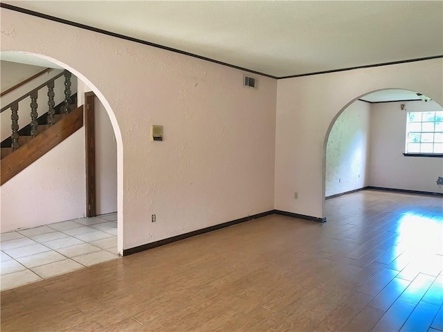 empty room with light hardwood / wood-style flooring