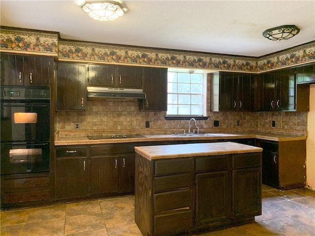 kitchen featuring light tile patterned floors, sink, decorative backsplash, and black appliances