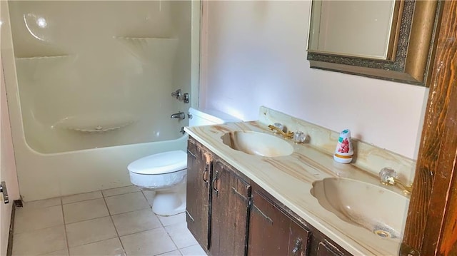 full bathroom with bathing tub / shower combination, toilet, vanity, and tile patterned floors