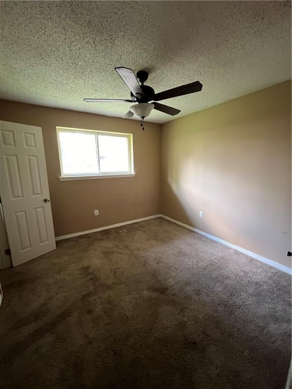 unfurnished bedroom with ceiling fan, a textured ceiling, and carpet floors